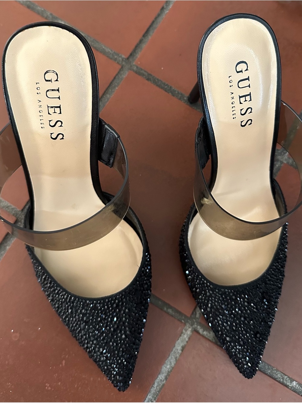 GUESS Black Rhinestone Embellished
Pointed-Toe Heels with Clear Straps